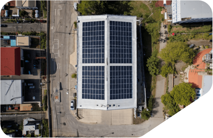 Technician inspecting solar array installation